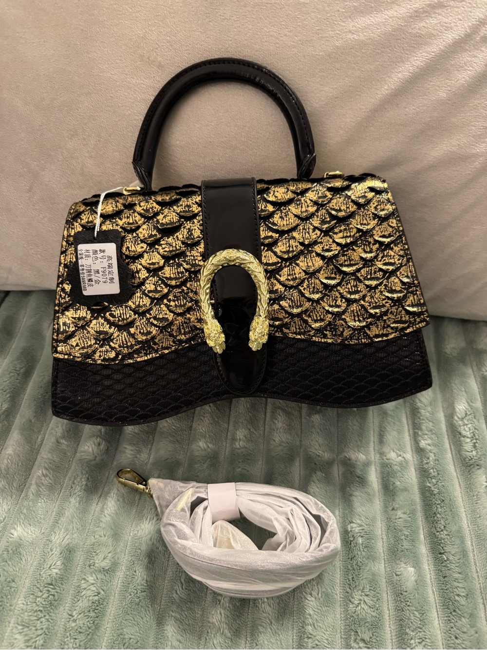 Black and Gold Textured Top-Handle Satchel with Decorative Horsebit